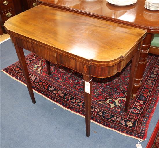 A George III inlaid mahogany folding tea table W.92cm